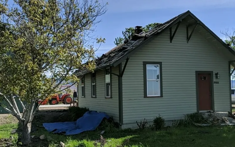 home with destroyed roof